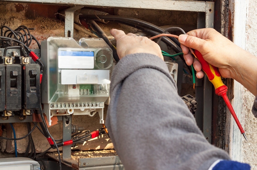 Repair,Of,Old,Electrical,Switchgear.,An,Electrician,Replaces,Old,Electrical